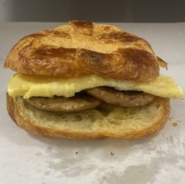 Egg and Ham, Bacon, Or Sausage on Croissant.