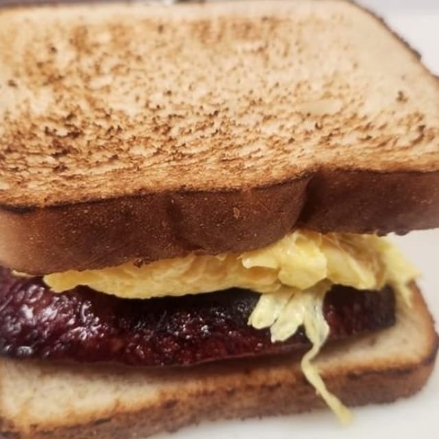 Egg And Bacon or Sausage Sandwich.